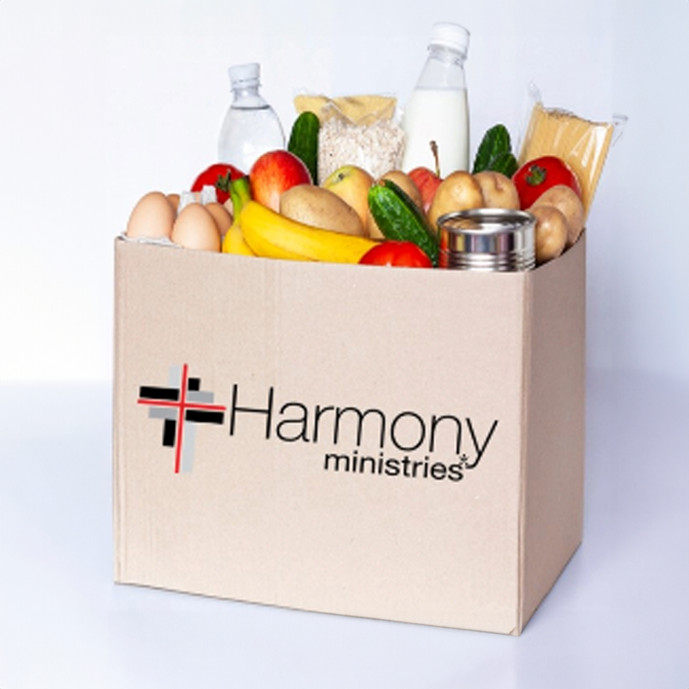 Bag of groceries with the Harmony Ministries Logo on the front